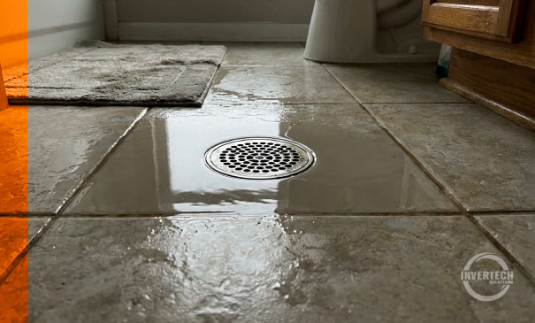 Flooded patio drain after rain, septic backup Florida home